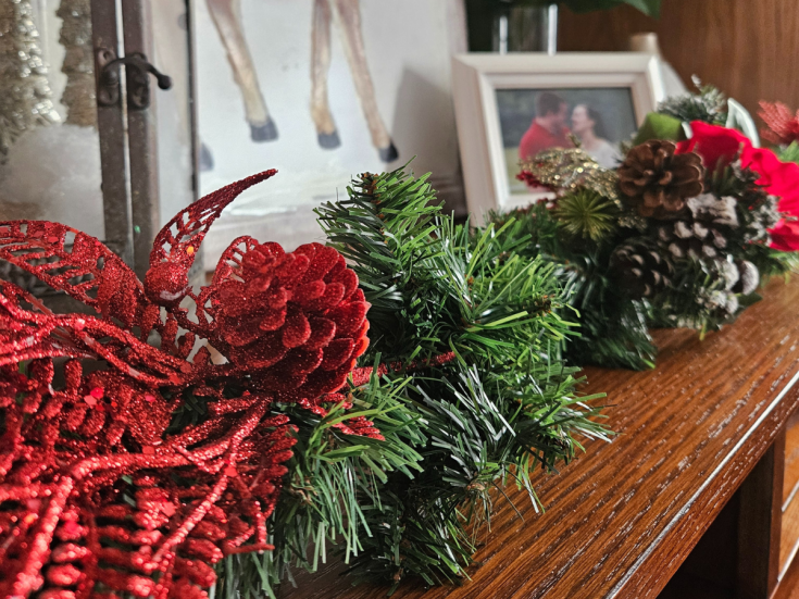 faux pine garland with red and brown embellishments for Christmas