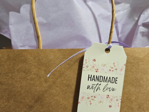 floral handmade with love gift tag on a brown paper bag