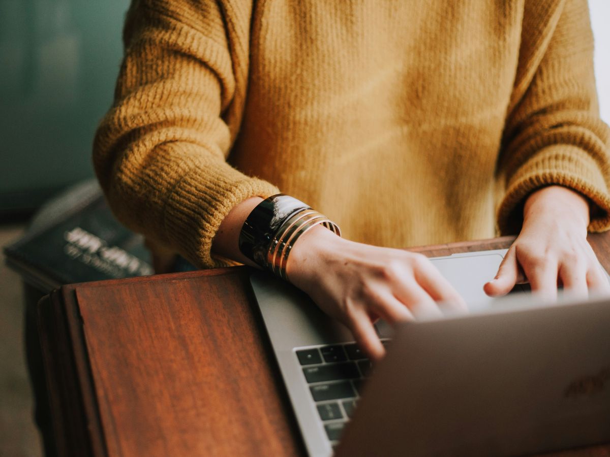 woman typing at a laptop