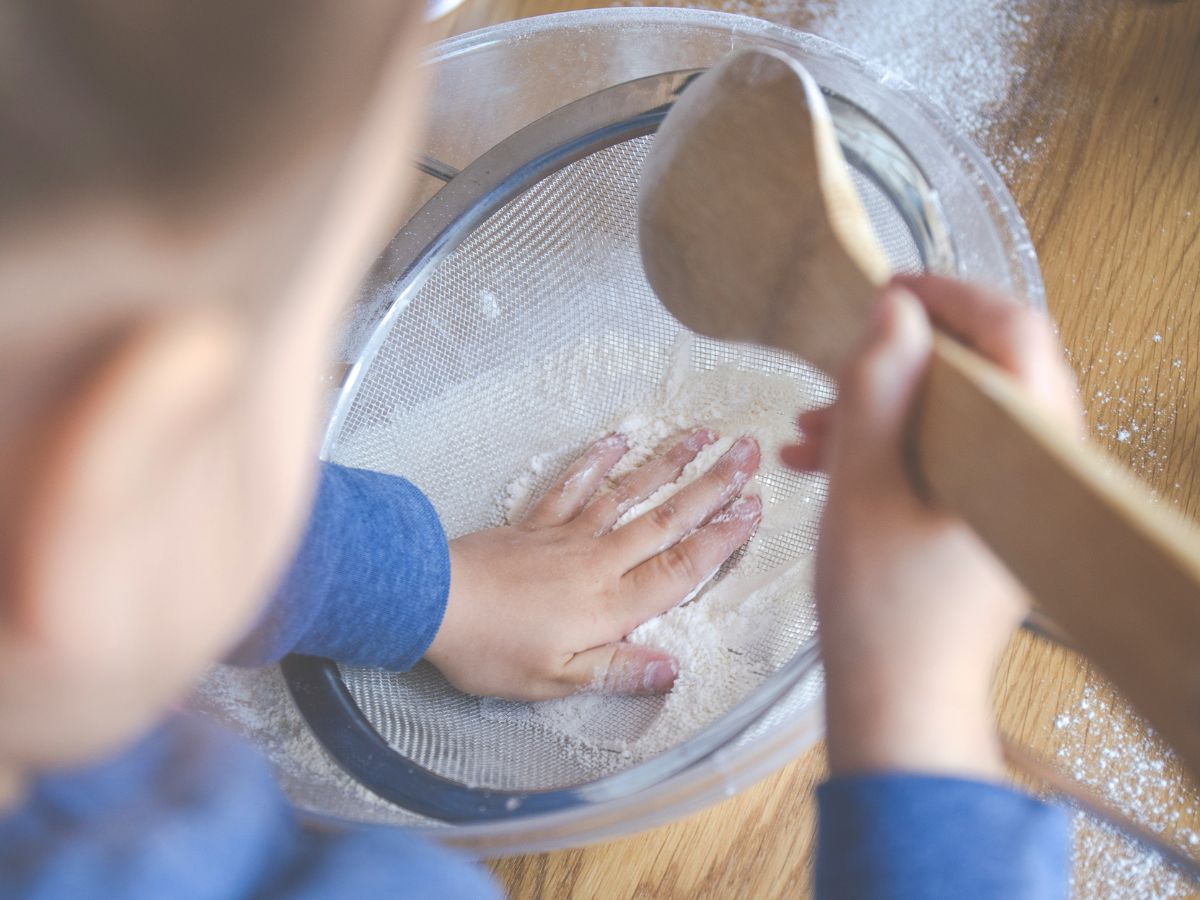 child playing in flour