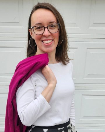 woman posing with gem colored cardigan