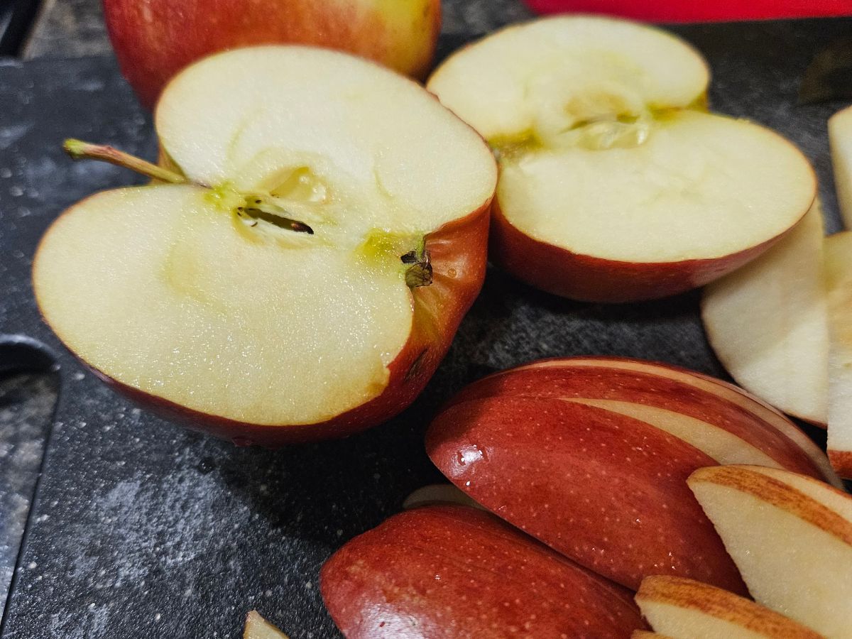 chopped apples on a black cutting board