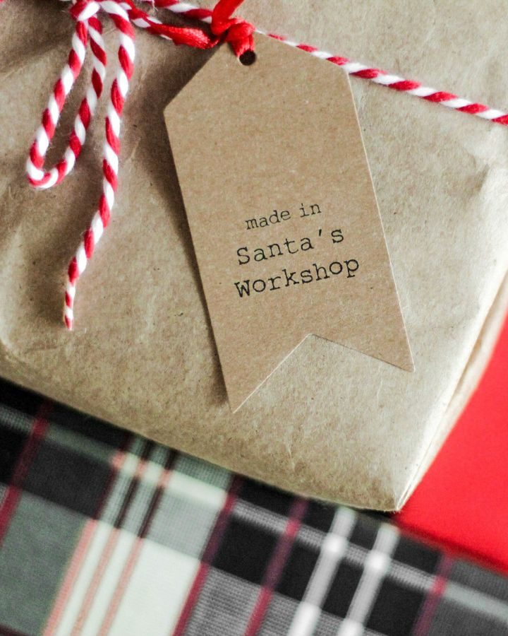 brown package wrapped with tag from Santa's workshop